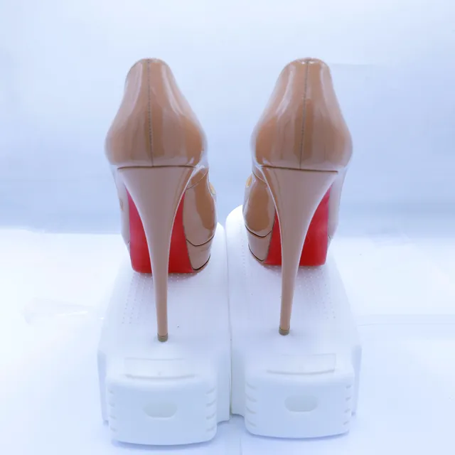 Christian Louboutin Nude Patent Leather Pumps