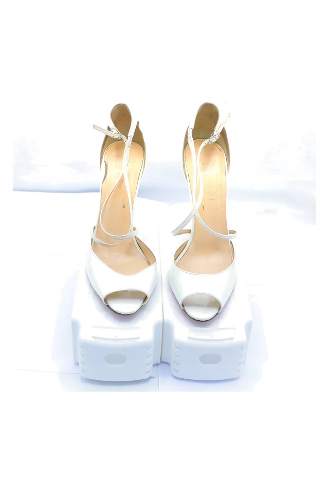 Christian Louboutin White Patent Leather Pumps