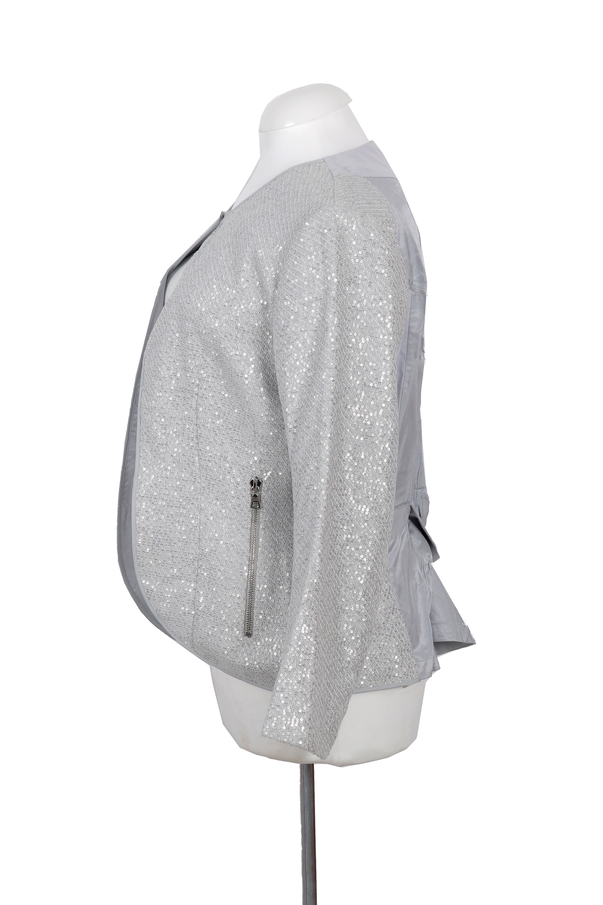 An elegant Nina Ricci jacket in shimmering silver, tailored with a sleek open-front design