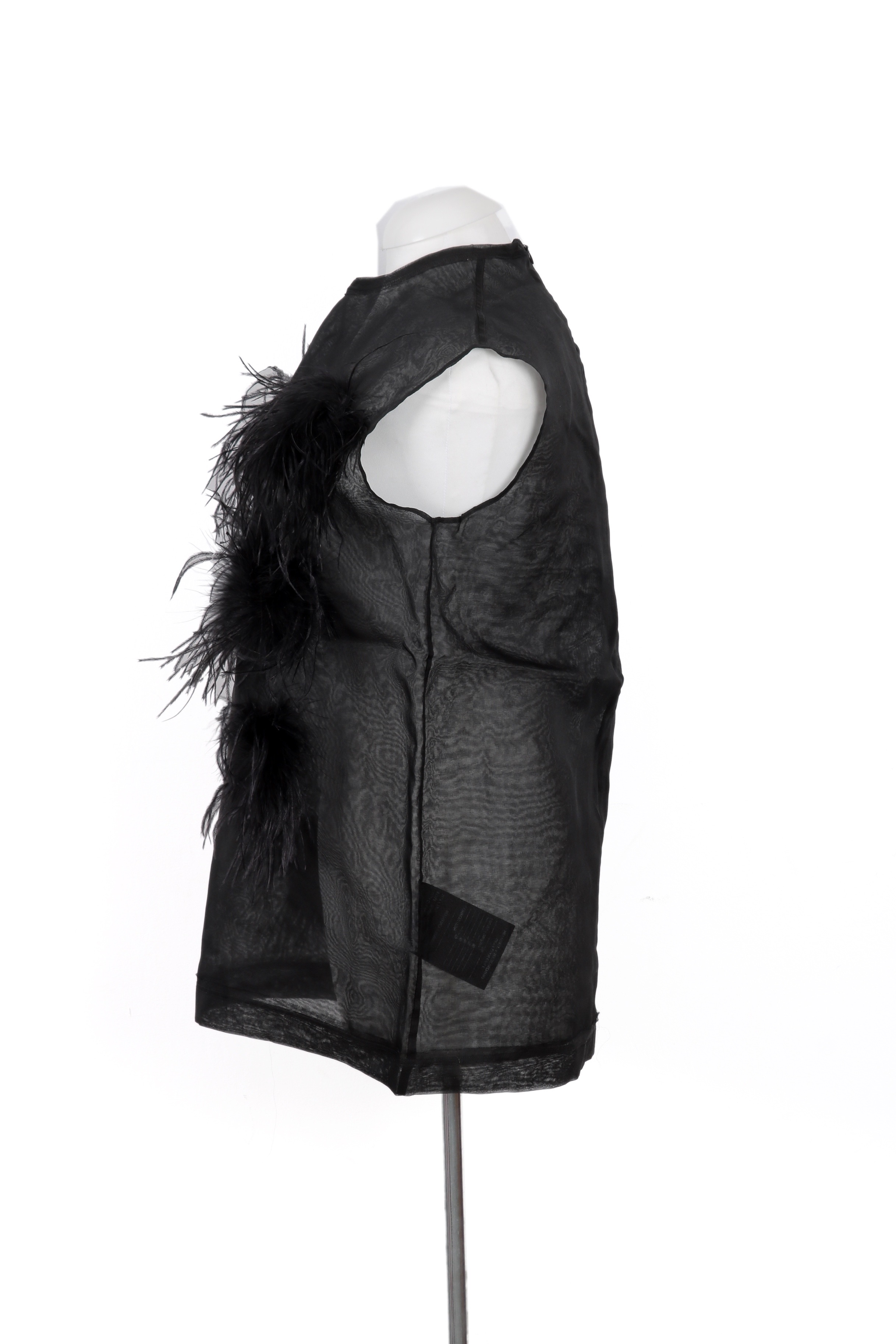 Sheer black polyamide top by Peet Dullaert, accented with dramatic feather embellishments for a bold, avant-garde statement