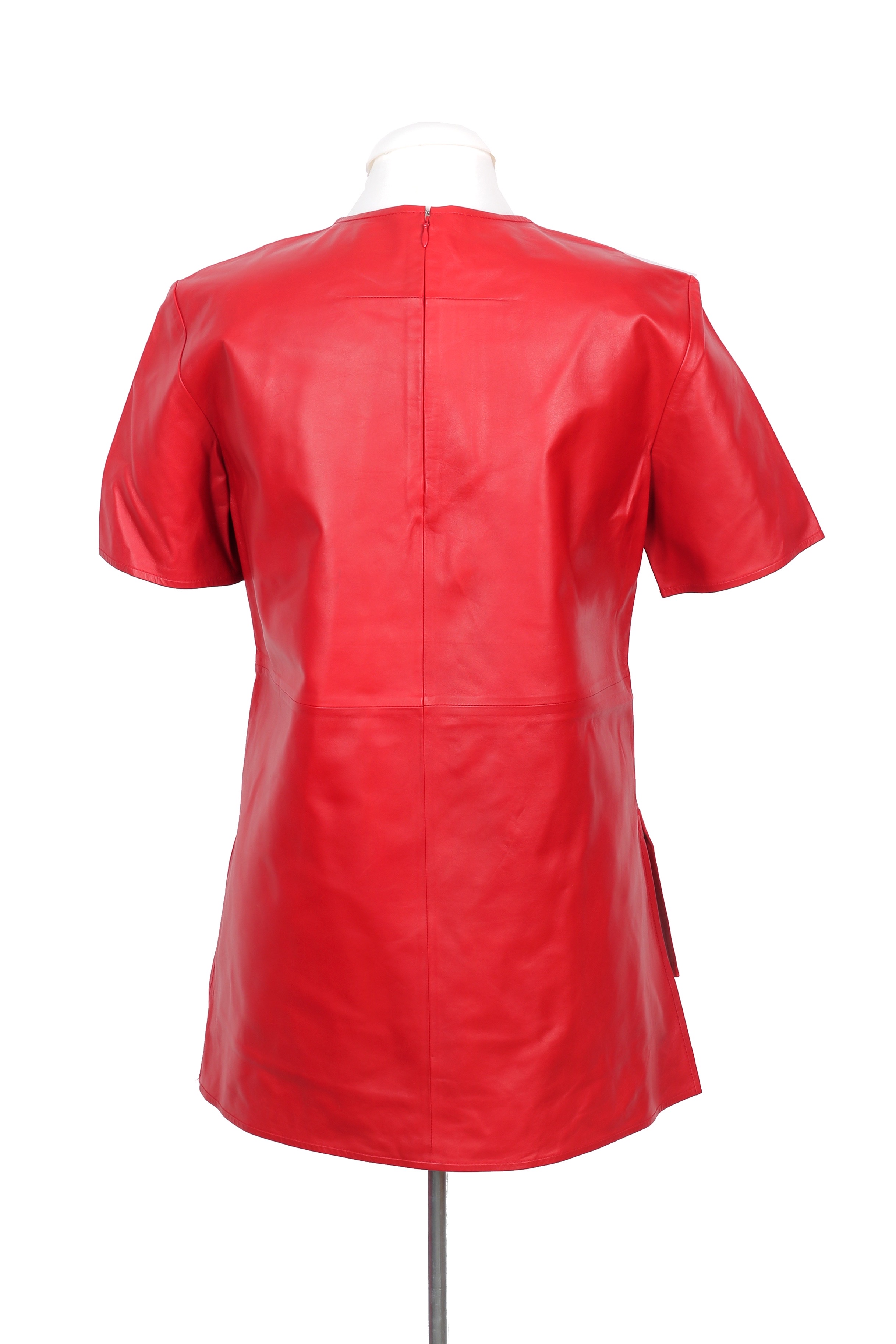 An exquisite Givenchy top crafted from 100% lambskin leather, showcasing short sleeves and a chic high-low hem