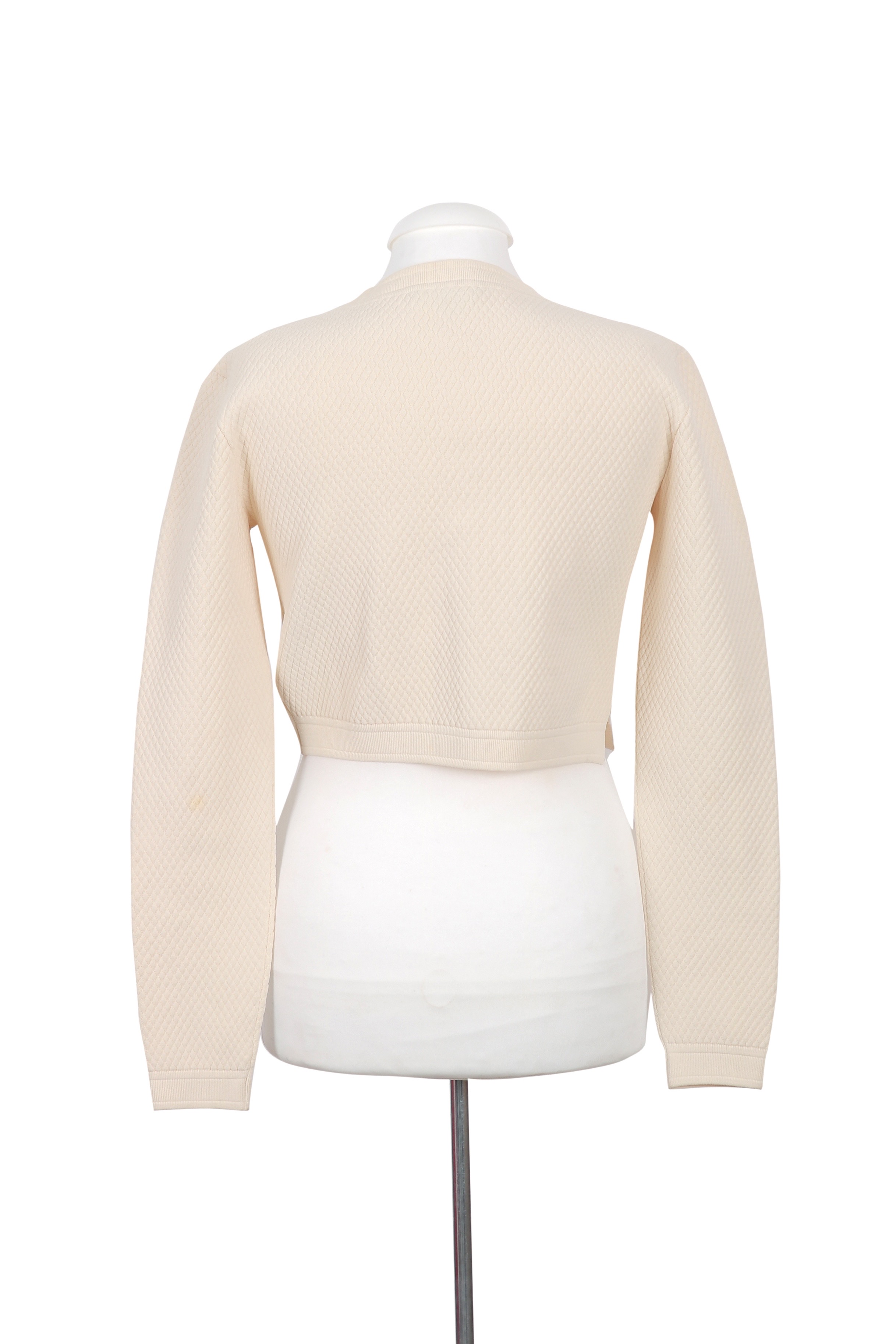 A refined Gucci cream cardigan with a cropped silhouette, crafted in textured knit for a chic and versatile look