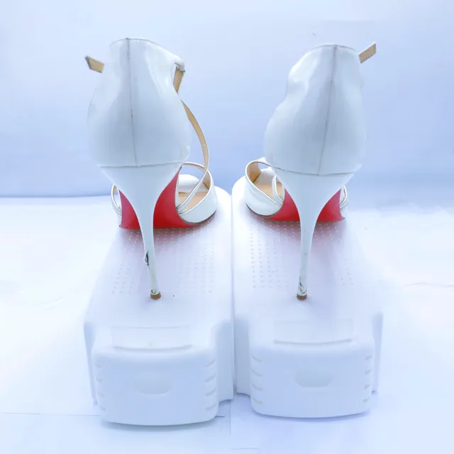Christian Louboutin White Patent Leather Pumps