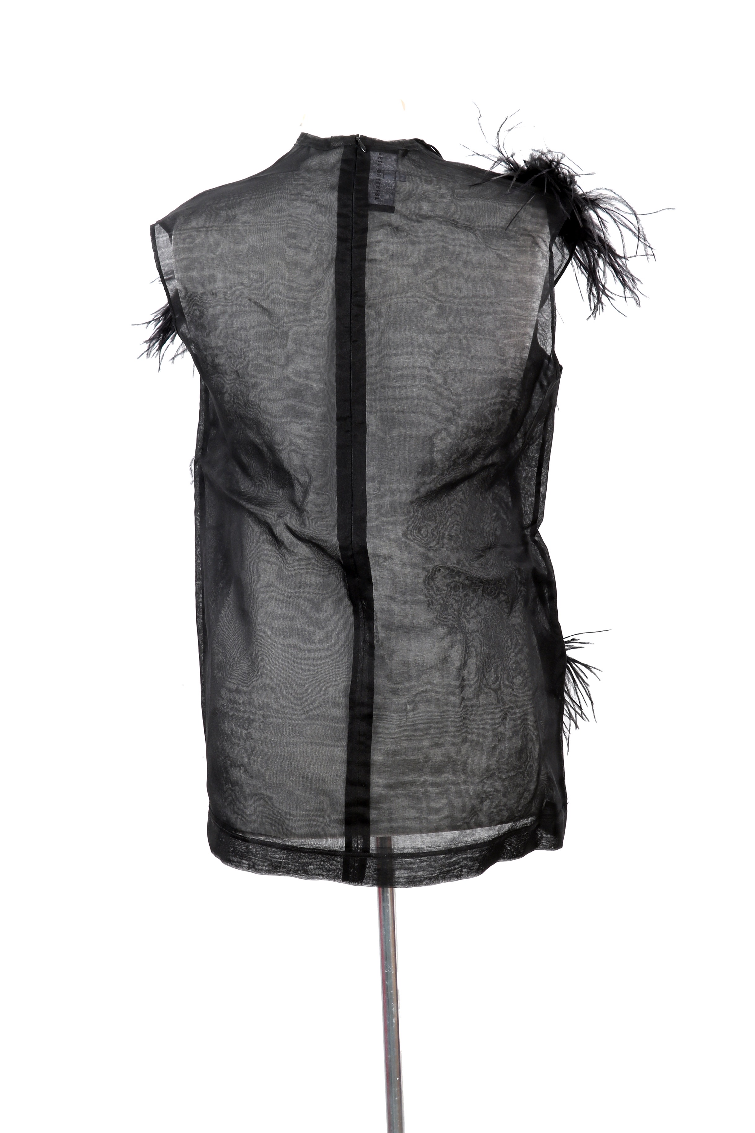Sheer black polyamide top by Peet Dullaert, accented with dramatic feather embellishments for a bold, avant-garde statement