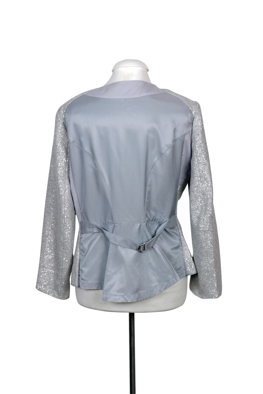 An elegant Nina Ricci jacket in shimmering silver, tailored with a sleek open-front design